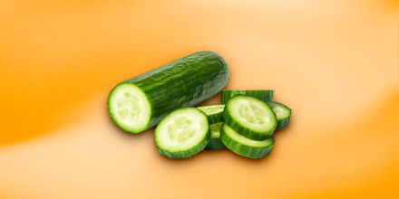 Cucumbers on an orange background.